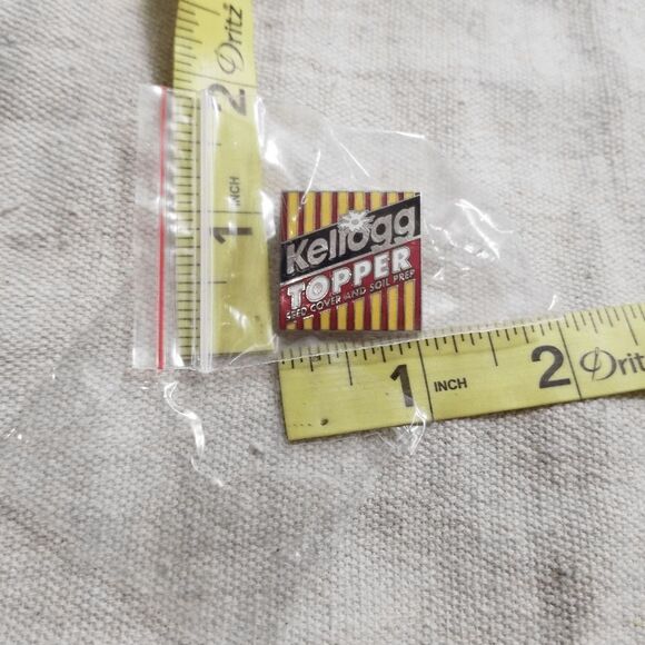 Kellogg Topper seed cover and soil prep vintage lapel pin 19 - Picture 1 of 3